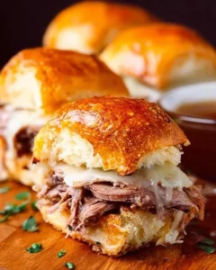 Delicious French Dip Sliders served with au jus for dipping