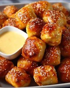 Delicious homemade soft pretzel bites served with mustard dip.