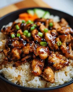 Honey BBQ Chicken Rice served in a bowl with fresh vegetables