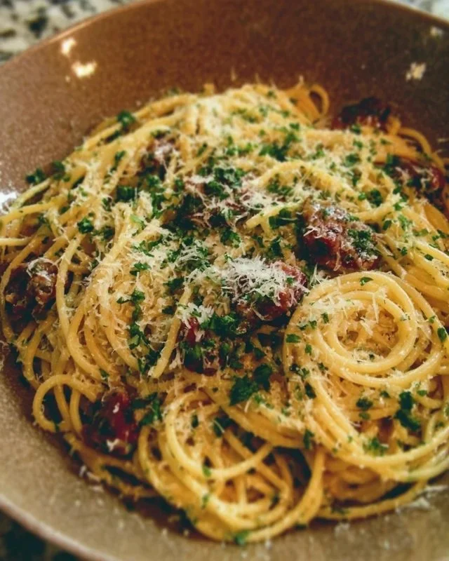 Ina Garten's midnight pasta recipe featuring garlic, olive oil, and spaghetti.