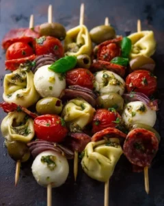 Italian antipasto skewers featuring marinated tortellini and mozzarella cheese