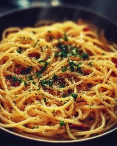 Delicious Midnight Pasta served with fresh herbs and cheese