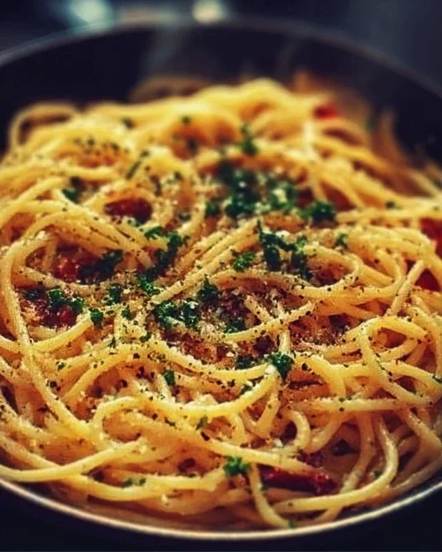 Delicious Midnight Pasta served with fresh herbs and cheese
