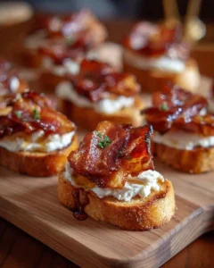 Plate of Million Dollar Bacon Crostini garnished with herbs and served as an appetizer