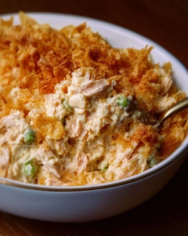 Delicious hot chicken salad recipe by Paula Deen served in a bowl.