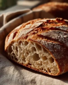 Freshly baked sourdough bread on a wooden table