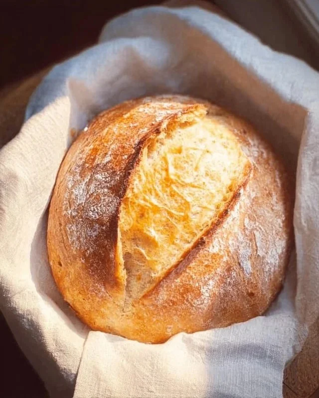 Homemade sourdough bread with a crispy crust and airy interior