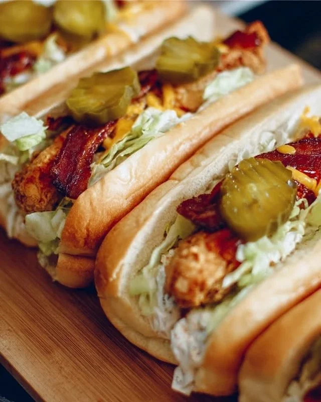 Delicious South Carolina bird dog sandwiches with toppings and sides.