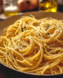 Delicious spaghetti with garlic and oil garnished with parsley served on a plate