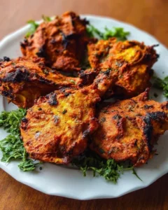 Delicious tandoori chicken served with naan and fresh herbs