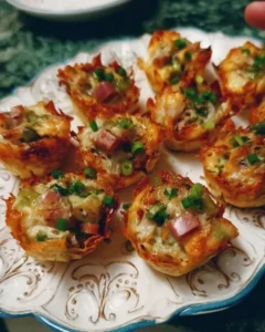 A platter of various cold appetizers, including dips, veggies, and cheeses.