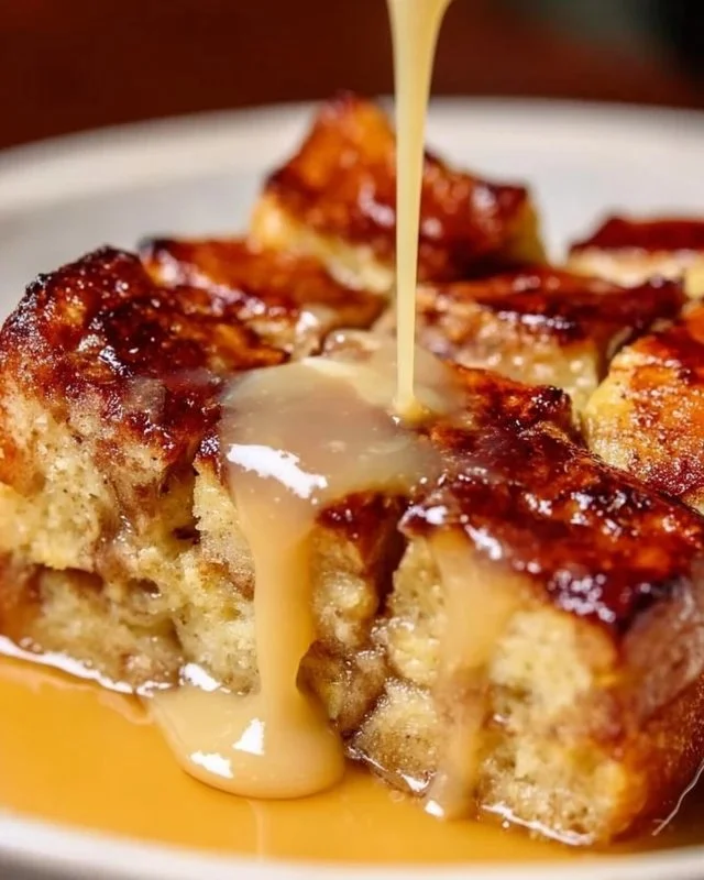 Delicious classic New Orleans bread pudding served with a creamy sauce