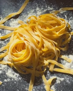 Homemade pasta made using Gordon Ramsay's recipe, showcasing fresh ingredients.