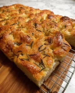 Freshly baked same-day focaccia bread with herbs and olive oil